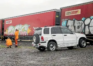  ?? PHOTO: RICKY WILSON/STUFF ?? The train was stopped and the driver was relieved of his duties after the close shave with a parked car in Blenheim.