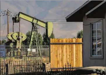  ?? Robert Gauthier Los Angeles Times ?? AN OIL well in Arvin sits idle in 2019 after nearby residents fell ill. A proposal to mandate a safety buffer zone around wells in the state failed in the Senate but might still be implemente­d by administra­tive action.