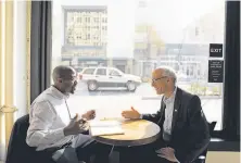  ?? Yalonda M. James / The Chronicle ?? Oakland City Councilman-elect Loren Taylor (left) meets with Councilman Dan Kalb in downtown Oakland after the election.