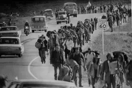  ?? John Beard, Denver Post file ?? Up to 4,000 people move north on U.S. 34 near Granby after the road was opened. The march to the Rainbow Family of Living Light religious gathering near Strawberry Lake in July 1972 was peaceful.