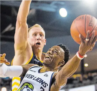  ?? JULIE JOCSAK TORSTAR FILE PHOTO ?? Alex Johnson, shown going up for a layup, is returning to the Niagara River Lions of the Canadian Elite Basketball League for a second season.