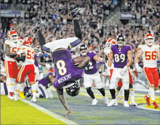  ?? Julio Cortez The Associated Press ?? Baltimore Ravens quarterbac­k Lamar Jackson scores a touchdown during the fourth quarter against the Kansas City Chiefs.