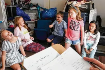  ?? Jon Shapley / Houston Chronicle ?? Lorelei Poole, 9, from left, her sister Aubri Poole, 11, Johnny McNeese, 10, Stella Reeves, 8, and Raquel Echevarria, 10, brainstorm ideas for a theater production during Hurricane Camp.