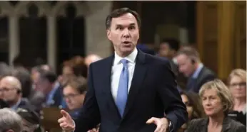  ?? SEAN KILPATRICK/THE CANADIAN PRESS ?? Finance Minister Bill Morneau pushed back against what he called "absurd allegation­s" over the sale of shares.