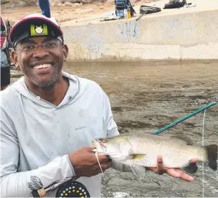  ??  ?? Barramundi like this little model caught by Tedla Morgan are a popular catch when anglers fish below weir walls.