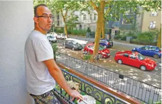  ?? — REUTERS/Fabrizio Bensch ?? BONE OF CONTENTION: Syrian migrant Oudai Alhomsi poses on the balcony of his apartment in Berlin, Germany July 31, 2018.