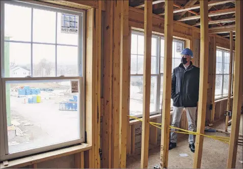  ?? Paul Buckowski / Albany Times Union ?? Todd Curley of The Prime Companies, is seen at The Delaware, the company’s multiuse project on Van Schaick Island in Cohoes. It will have one about 100 units of mixed-income housing and commercial space, including a drive-thru food option.