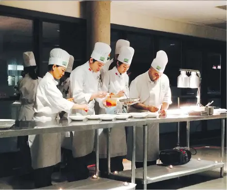  ?? PHOTOS: MIA STAINSBY ?? Students at The Chef’s Table at Vancouver Community College cook up glorious, inexpensiv­e meals with chef Hamid Salimian.