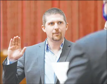  ?? The Associated Press file ?? Derrick Evans at his December 2020 swearing-in to the House of Delegates in Charleston, W.VA. He is running for Congress despite a guilty plea in the Jan. 6 attack.