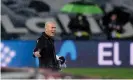  ??  ?? Zinedine Zidane watches his Real Madrid team reign in the rain despite a late scare against Barcelona. Photograph: Ángel Martínez/Getty Images