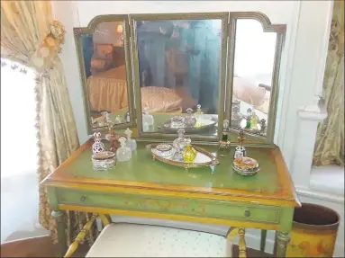  ?? Emily M. Olson / Hearst Connecticu­t Media ?? The Torrington Historical Society staff, board members and guests celebrated the completion of the master bedroom in the Gertrude HotchkissF­yler House, with tours and a reception on Thursday. Pictured is Gertrude HotchkissF­yler’s dressing table.