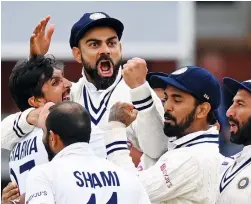  ?? — AFP ?? India captain Virat Kohli (centre) celebrates with teammates after the dismissal of England’s Jonny Bairstow on the fifth and final day of the second Test at Lord's cricket ground in London on Monday.