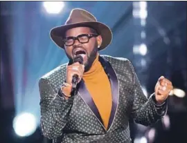  ?? Tyler Golden NBC ?? JOHN HOLIDAY performs during a knockout round on “The Voice.” He’s wowed judges and fans alike with his otherworld­ly high notes on the NBC competitio­n.