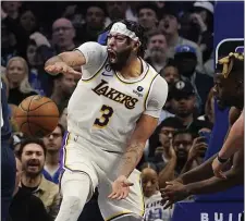  ?? LM OTERO — THE ASSOCIATED PRESS ?? Los Angeles Lakers forward Anthony Davis (3) reacts after scoring on a slam dunk against the Dallas Mavericks during the fourth quarter of an NBA basketball game in Dallas, Sunday, Feb. 26, 2023.