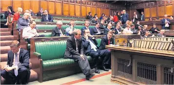  ??  ?? MPs bide their time in the Chamber of the House of Commons after being told to remain inside during the attack