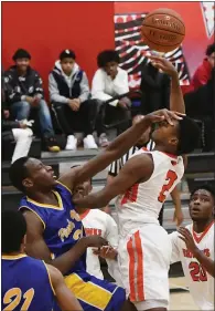  ??  ?? Deven Johnson has his eyes covered by Andre Astrel from Pinole Valley during Thursday’s game in Vallejo. No foul was called on the play.