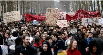  ??  ?? Students gather to protest against French government’s string of reforms in Paris. — AFP photo