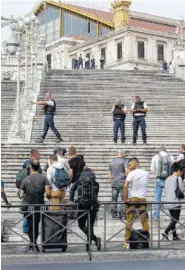  ?? THE ASSOCIATED PRESS ?? French police officers block access on the stairs leading to Marseille’s main train station Sunday in southern France.