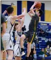  ?? AIMEE BIELOZER — FOR THE MORNING JOURNAL ?? Amherst’s Ausstin Kucirek shoot a layup against North Ridgeville on Fe. 12.