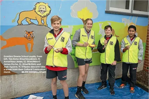  ?? BEJON HASWELL/STUFF ?? Grantlea Downs School pupils, from left, Tim Kirke (Kiwi/Slovakian), 11, Annachaez Jones, 12, (Kiwi/Ma¯ori) James Dyche, 12, (Kiwi/British) and Josh Aguirre, 11, (Filipino descent) take a break from their Cultural Celebratio­n mural.