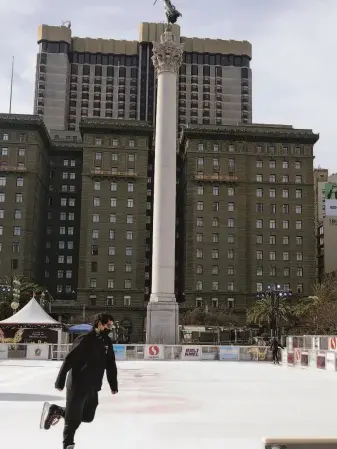  ?? Carl Nolte / The Chronicle ?? An ice skater has the rink pretty much to himself as Union Square remains mostly quiet.