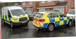  ??  ?? Raid: Warrington police outside the Mahers’ home in Woolston when the couple were arrested last October in relation to the 39 deaths