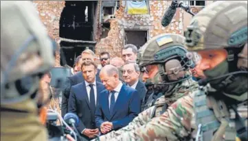  ?? AFP ?? (Left to right) French President Emmanuel Macron, German Chancellor Olaf Scholz and Italian PM Mario Draghi visit Irpin.