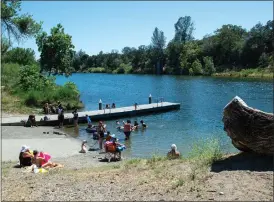  ?? ?? Families spend time by the water on June 20at Riverbend Park in Oroville.