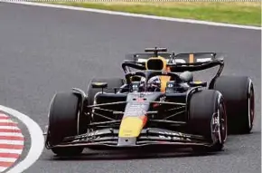  ?? AFP PIC ?? Red Bull Racing’s Max Verstappen taking a corner during the first practice session at the Suzuka Circuit yesterday.