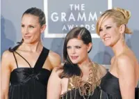  ?? AP PHOTO/MATT SAYLES ?? The Dixie Chicks from left, Emily Robison, Natalie Maines and Martie Maguire arrive for the 2007 Grammy Awards in Los Angeles.