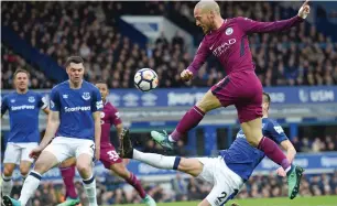  ?? AFP ?? David Silva up against Everton players during the Premier League match at Goodison Park. —