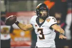  ?? AIMING FOR THE WIN: The Associated Press ?? Oklahoma State quarterbac­k Spencer Sanders (3) throws a pass against Miami during the second half of the Cheez-it Bowl Tuesday in Orlando, Fla.