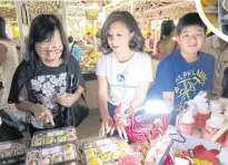  ??  ?? Ms Panita sets up a company which sells sweets and snacks, including khanom pia, marketed under the band ‘Farmhomm’. On sale at food fairs are health products for older customers which contain low sugar and salt and non-spicy ingredient­s. The company...