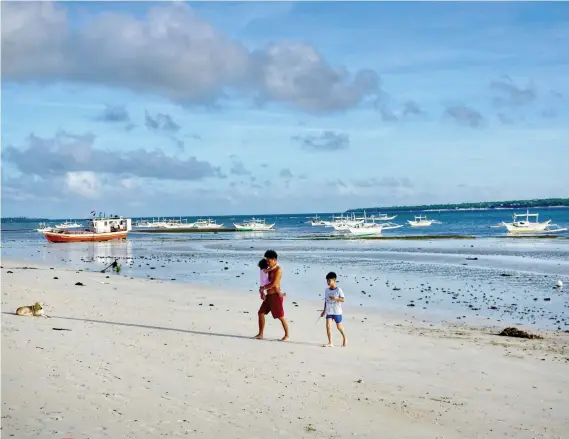  ?? SUNSTAR FOTO / AEX BADAYOS ?? A FUTURE BORACAY? In 2021, this empty beach in Bantayan may be teeming with local and foreign tourists. That is, if the plan to turn the airstrip in Sta. Fe into a commercial airport is realized. Access to the island is currently limited to motorized bancas, barges and Roro vessels.