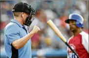  ?? JULIO CORTEZ / ASSOCIATED PRESS ?? Home plate umpire Brian deBrauwere calls a strike given to him via earpiece by a TrackMan computer system that uses Doppler radar in an Atlantic League All-Star minor league game last month in York, Pa.