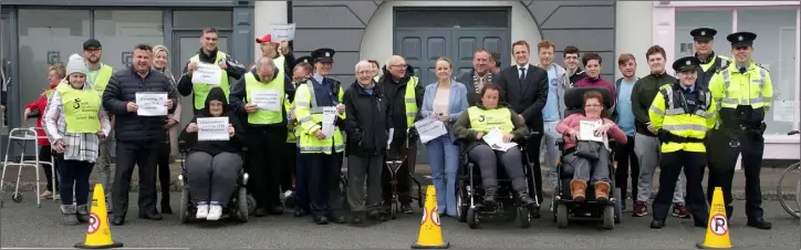  ??  ?? Wheelchair users with local representa­tives, Garda officers and supporters at Crescent Quay yesterday (Monday).