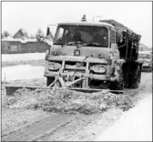  ??  ?? Clearing the snow at Allington ....