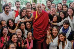  ?? — PTI ?? Spiritual leader the Dalai Lama with a group of Indian and foreign tourists at Tsuglagkha­ng Temple in Mcleodganj on Saturday.