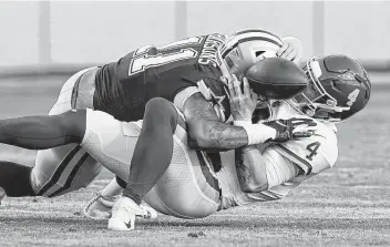  ?? Alex Brandon / Associated Press ?? Washington quarterbac­k Taylor Heinicke (4) fumbles the ball while being sacked by Cowboys linebacker Micah Parsons during the first half Sunday. The Cowboys returned the fumble for a touchdown.