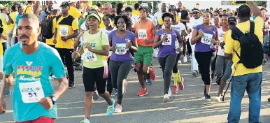  ?? FILE ?? Competitor­s get going at the recent Jamaica National Foundation-Usain Bolt Foundation Heroes in Action 8K Run-Walk and 4K Fun Run in Falmouth, Trelawny.