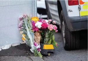  ?? MARK LEWIS ?? Some of the floral tributes left at the scene