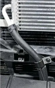  ??  ?? The supplied hose has a 400-psi rating and will route easily up past the bumper brackets to the inlet and outlet ports on the new transmissi­on cooler. Supplied hose clamps and brackets will allow you to secure the hoses to the truck, so there will be no concerns of them rubbing or leaking.