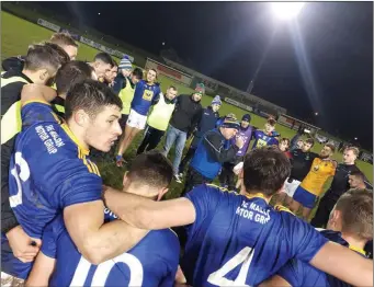  ??  ?? Wicklow manager John Evans speaks to his troops after their wonderful win in Waterford.