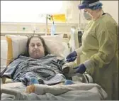  ?? Alex Horvath The California­n ?? NURSE Angela Bilyeu assists patient Pedro Cortez on July 24 at Memorial Hospital in Bakersfiel­d. Kern County tops the state in new COVID cases.