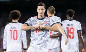  ?? Photograph: DeFodi Images/Getty Images ?? Robert Lewandowsk­i celebrates scoring the first of his two goals. The forward has scored in 18 successive appearance­s for Bayern Munich.