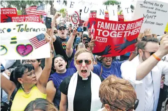  ?? MIGUEL ROBERTS, THE ASSOCIATED PRESS ?? Protesters chant “Families belong together!” last month in Brownsvill­e, Texas, to denounce the detention of thousands of immigrant children in the United States.