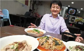  ?? photos: izzrafiq alias, LOW BOON tat and Shaari Chemat/the Star ?? Lai showing some of the Foochow dishes served in Fatty Kampua Sarawakian House, Setapak.—