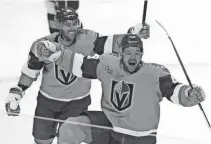  ?? STEPHEN R. SYLVANIE/USA TODAY SPORTS ?? Golden Knights center Tomas Hertl (48) celebrates with right wing Jonathan Marchessau­lt (81) after scoring a goal against the Avalanche in overtime.