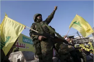  ?? (Ali Hashisho/Reuters) ?? A HEZBOLLAH member reacts to a televised speech by leader Sayyed Hassan Nasrallah in Lebanon.