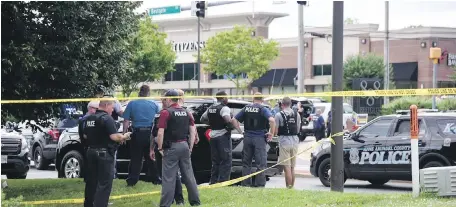  ??  ?? Police respond to a shooting at the Capital Gazette building in Annapolis, Maryland, on Thursday.